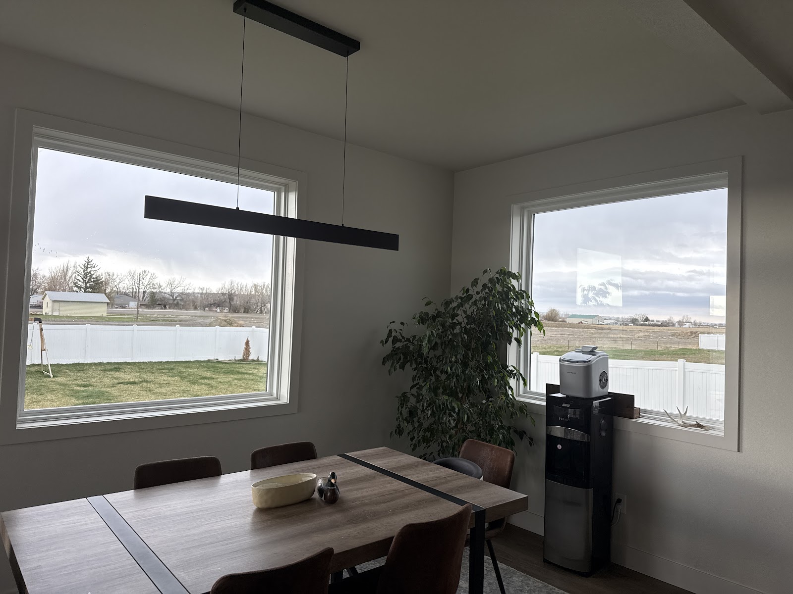 Spotless, streak-free windows in a bright dining room after cleaning